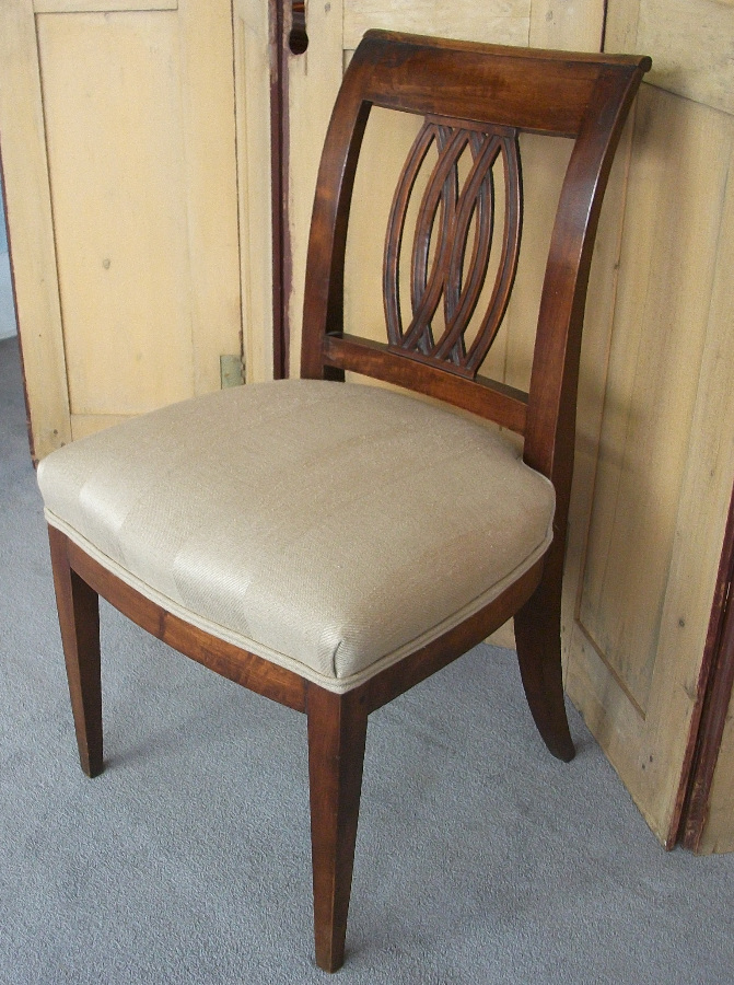  	Italian walnut chairs with sabre back legs and decorative pierced back splat. 